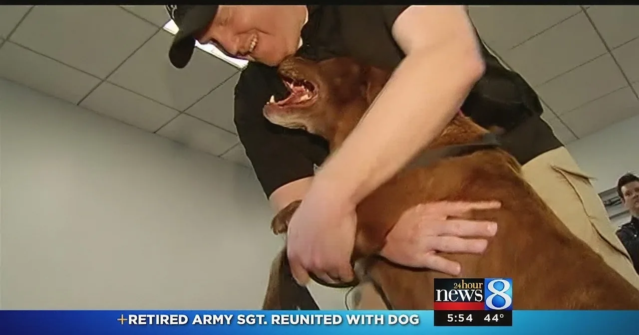 A retired Army Sgt. is joyfully reunited with his dog, embracing each other in a heartfelt moment.