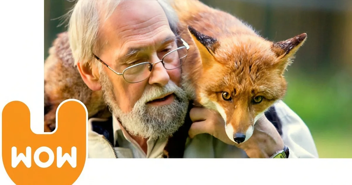 An elderly man with a fox on his shoulder, both looking directly at the camera.
