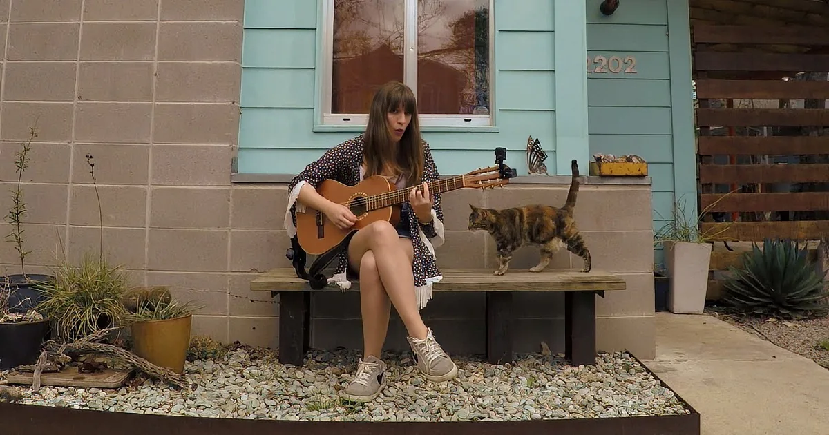She Started Singing and Playing Guitar. Keep Your Eye on the Cat...