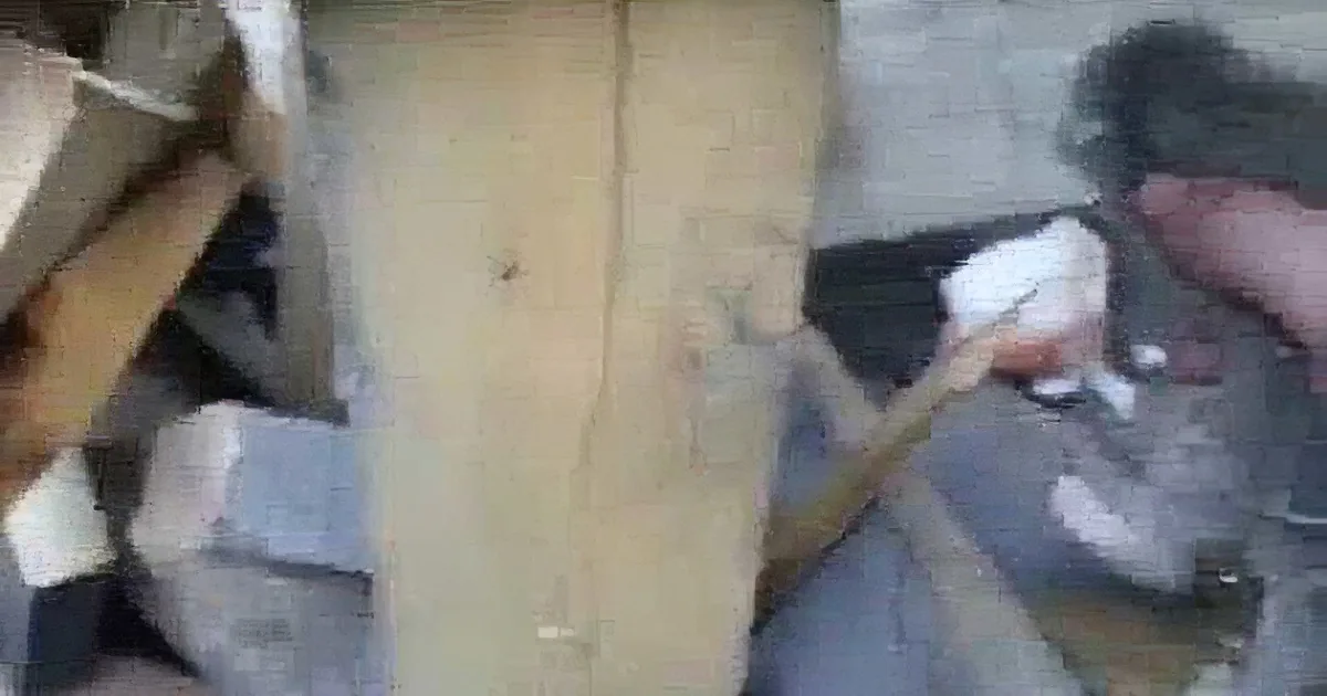 A person is using a tool to cut or shape a piece of wood.