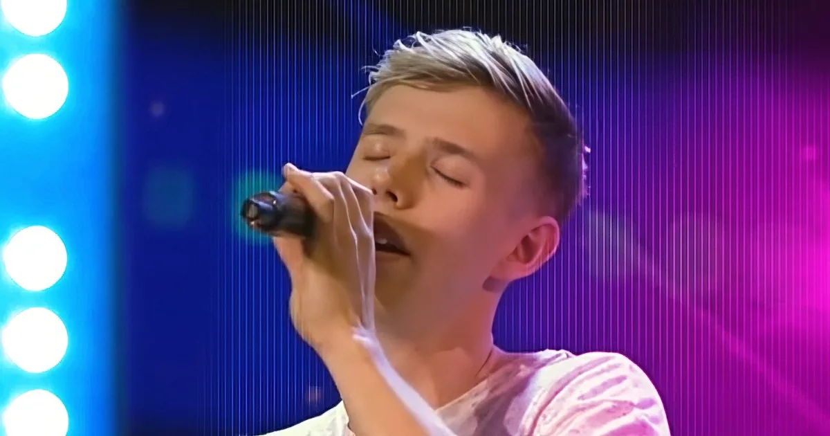 A person singing passionately into a microphone, eyes closed, with a vibrant blue and purple background.