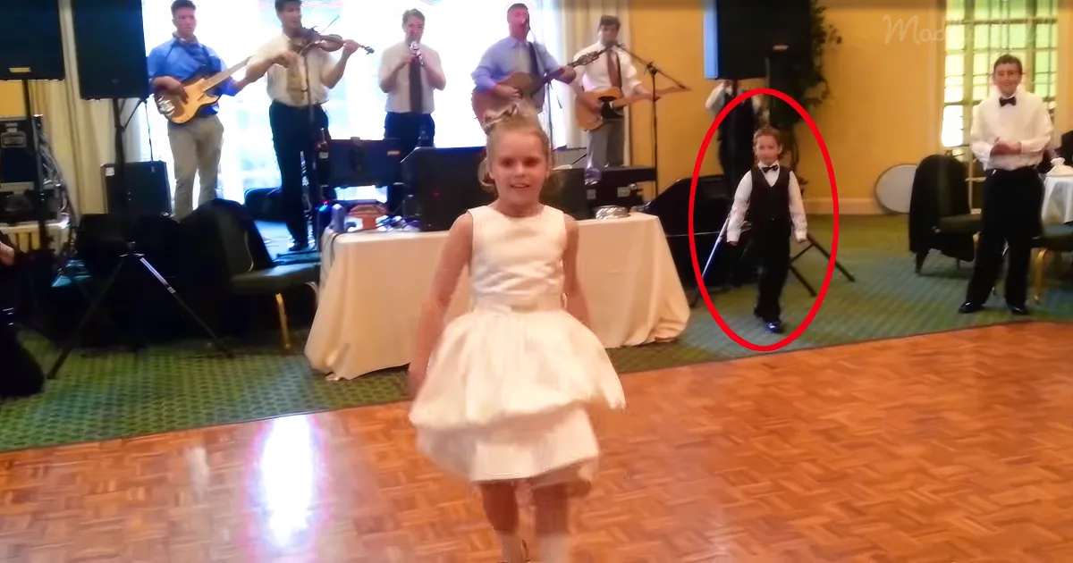 Girl Irish dancing, boy in background
