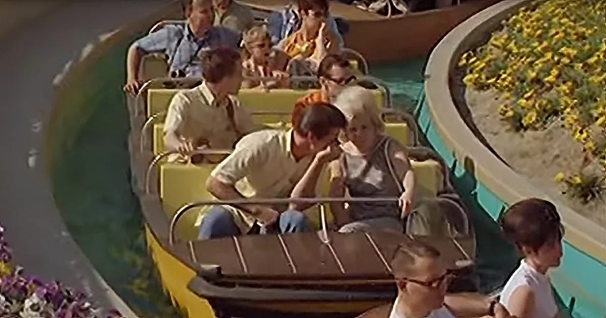A family enjoys a thrilling ride on a roller coaster, with a child resting their head on their hand.