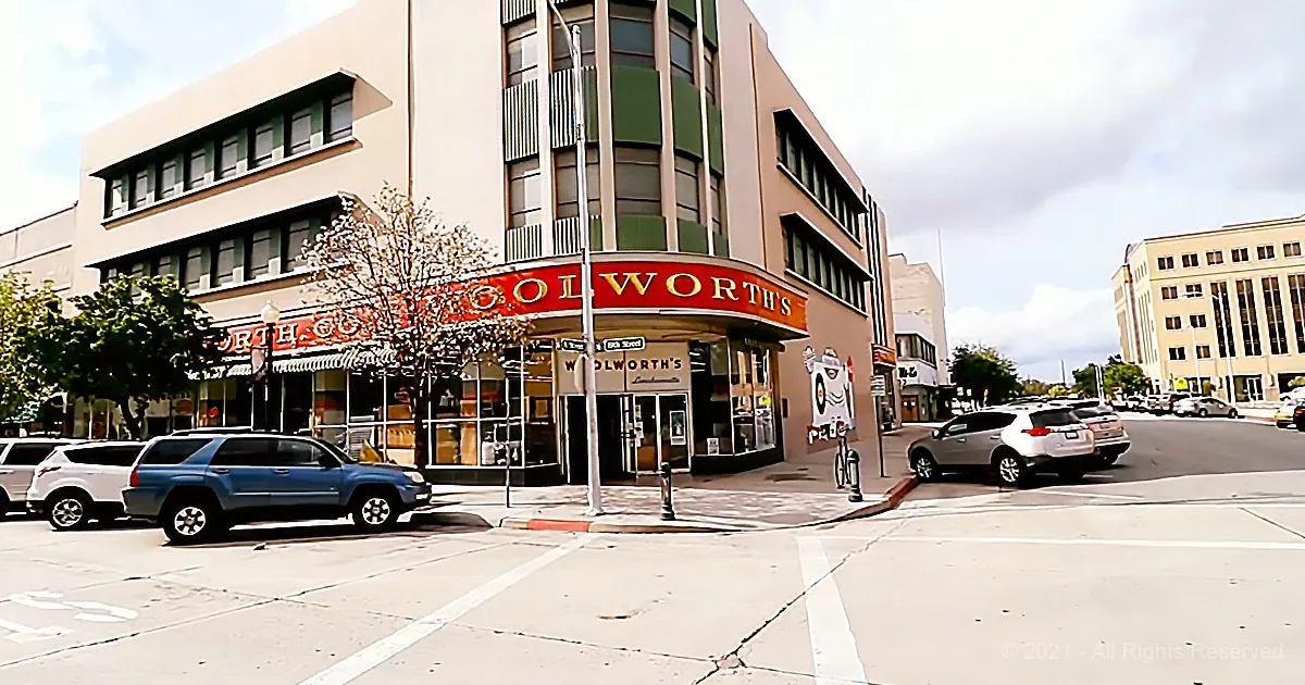 North Oakey Woolworth's store with cars parked in front and a cloudy sky.
