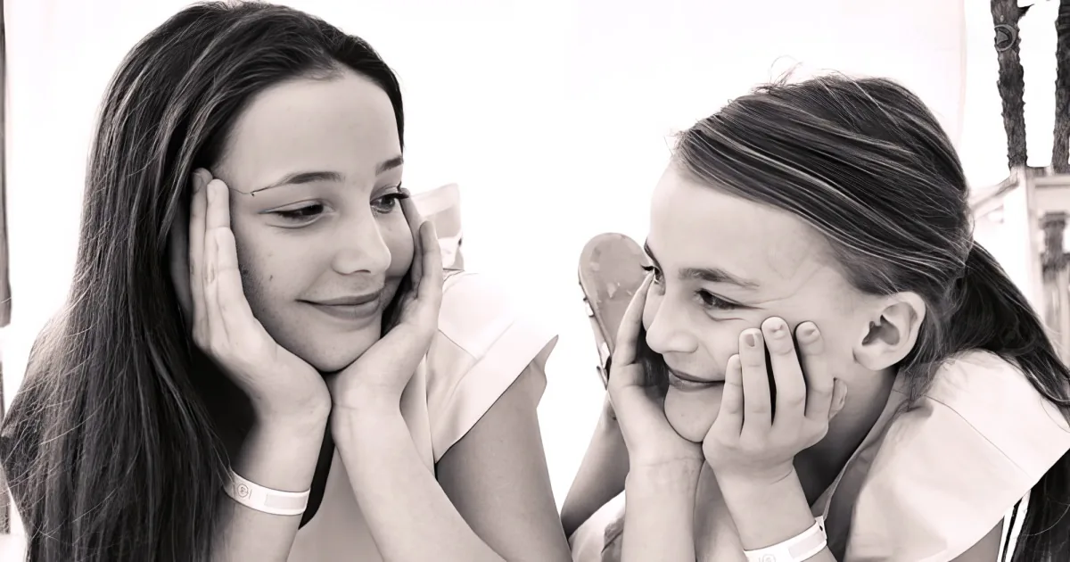 Two sisters singing 'You Raise Me Up
