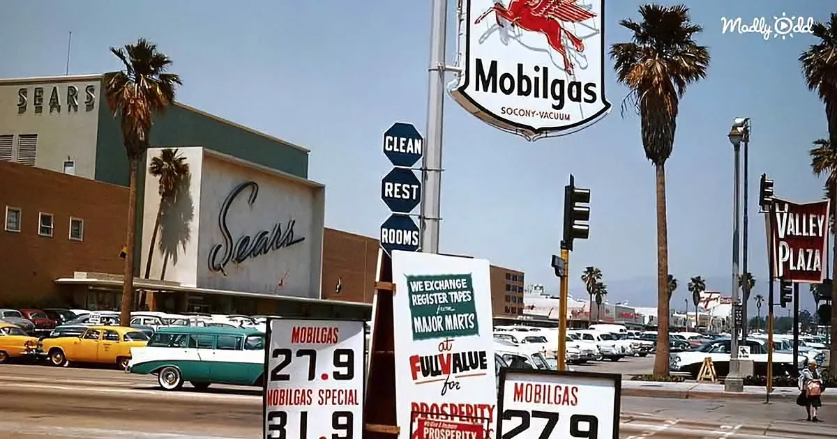 Vintage Mobilgas sign, palm trees, Sears building, retro cars, clear sky.