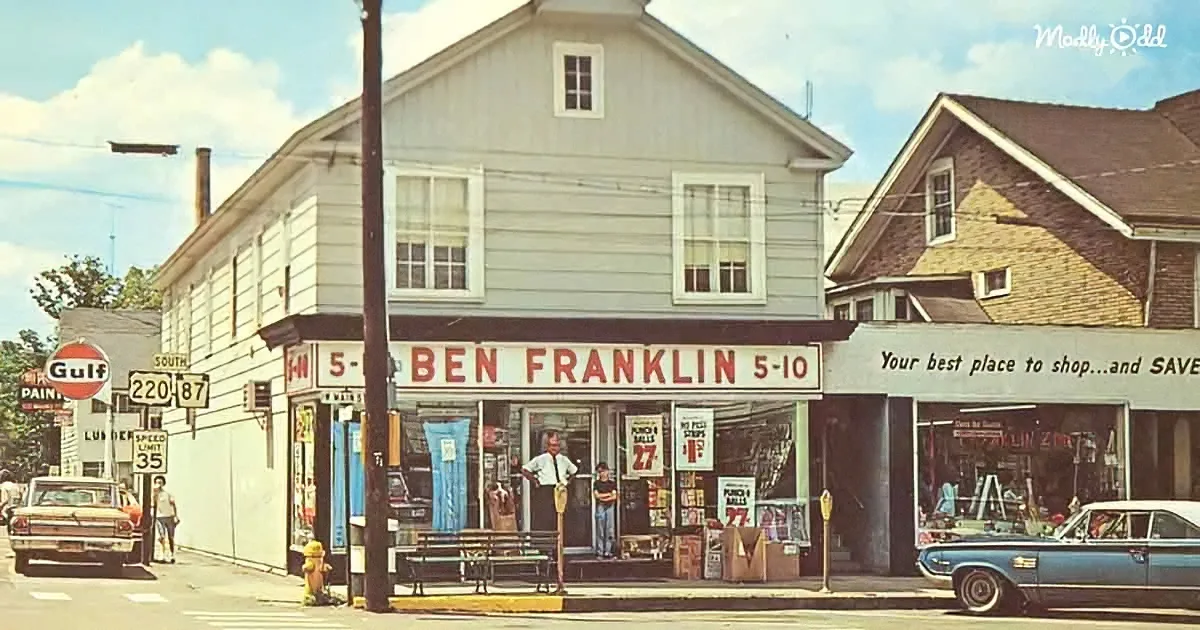 A vintage Ben Franklin 5-10 store with people outside, classic cars, and Gulf gas station sign.