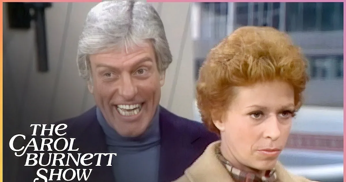 A man in a blue suit points at a woman in a red plaid shirt, while others in coats observe.