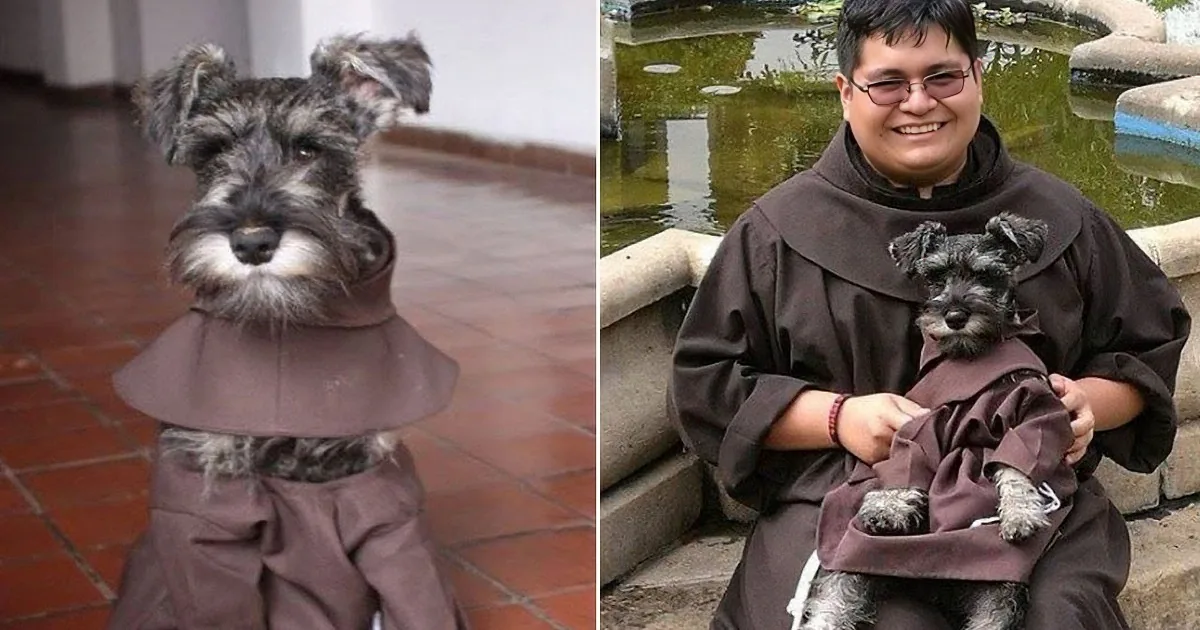 A smiling person holds a small, fluffy dog with a distinctive black and white coat.