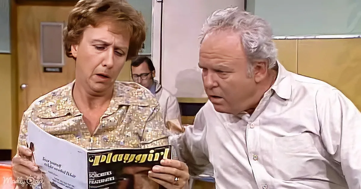 A man and woman are reading a "Playgirl" magazine together, appearing surprised or shocked.