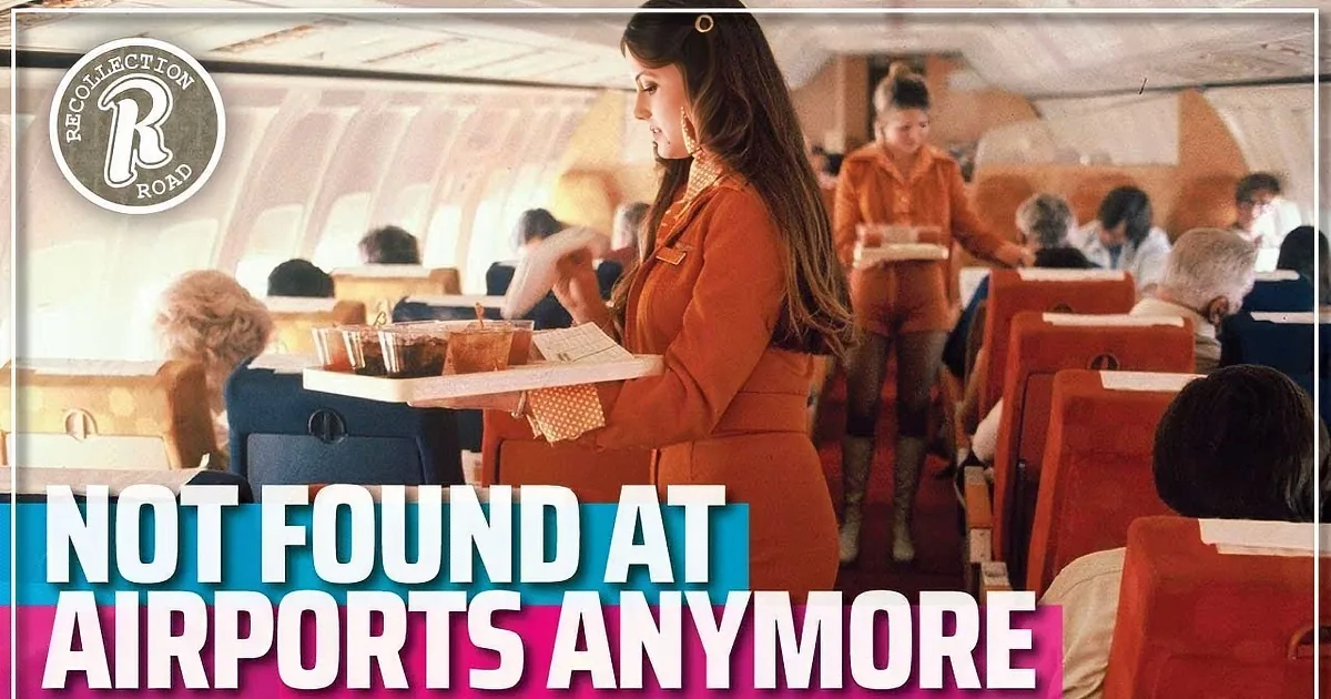 A man in a suit sits on a bench, talking on a phone, with a colorful airport scene and people watching planes in the...