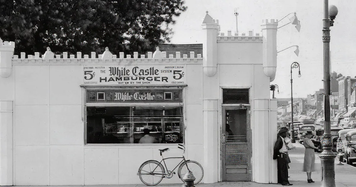 A vintage White Castle hamburger restaurant with brick facade and signage.