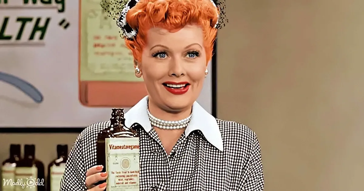 Lucille Ball holds a bottle labeled "Vitameatavegamin" in a vintage setting.